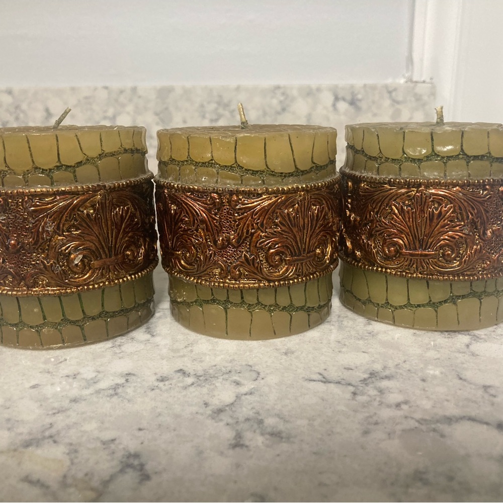 3 for $25 Item Set of 3 green and brown candles.